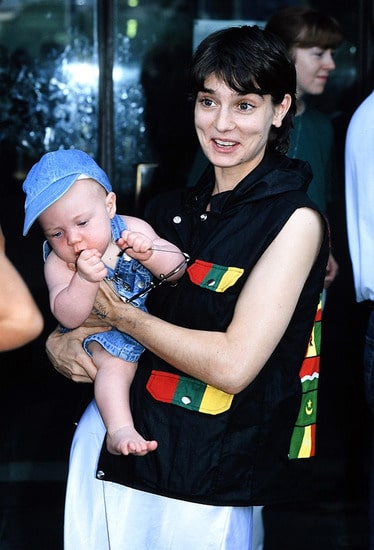 Sinead O'Connor holding her newly born child Roisin Waters